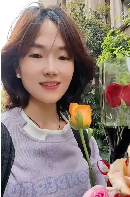 肖芬说，举起双手迎接终点是她的习惯性动作。（取材自新京报／受访者供图）
