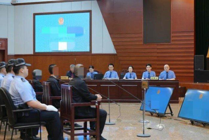 图为庭审现场 。(取材自检察日报)