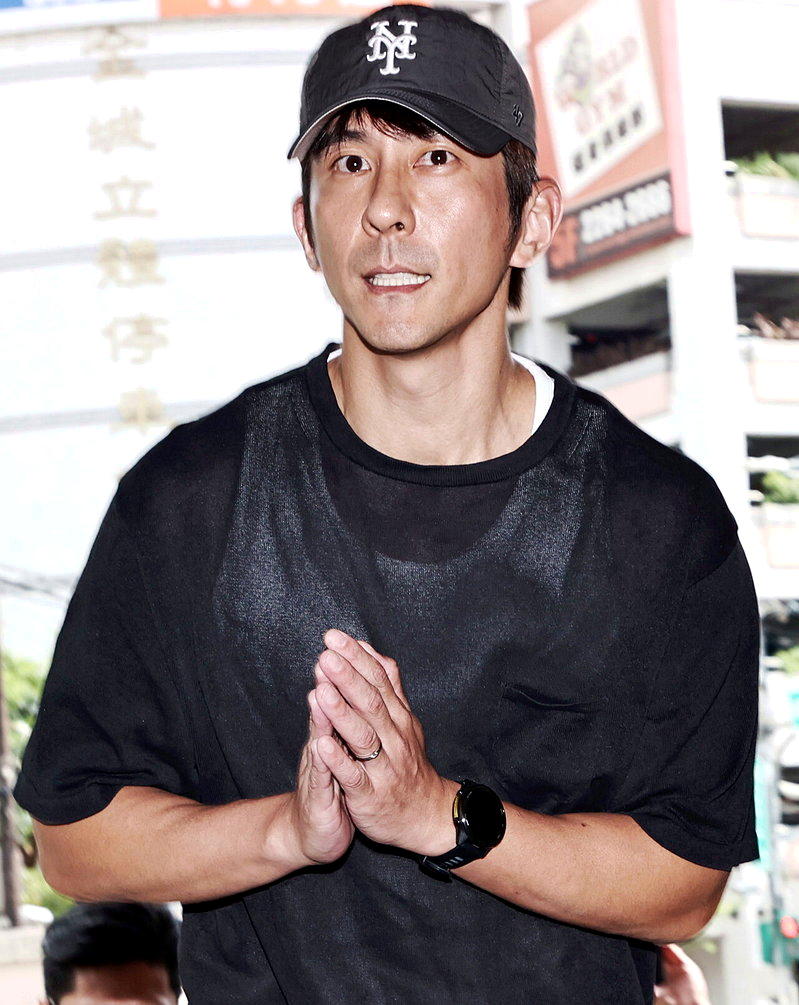 修杰楷陷闪兵风波已1年,不久前受洗成为基督徒。杜建重/摄影